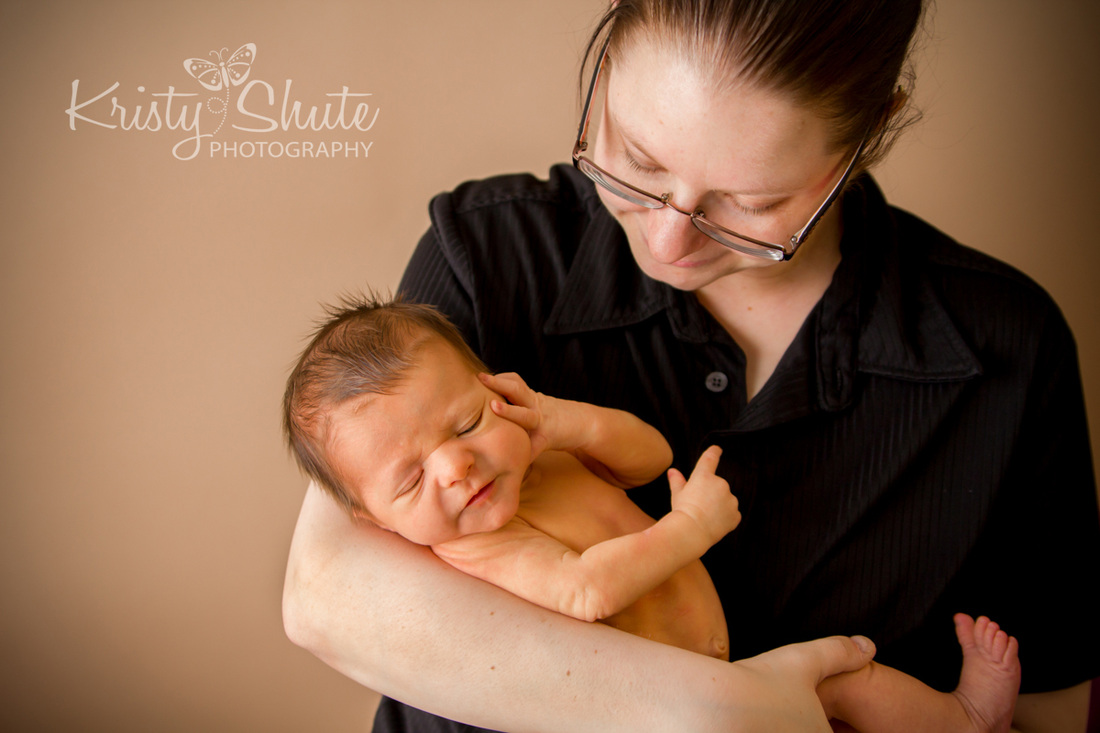 Kitchener Newborn Photography Kristy Shute Mom holding Baby Boy